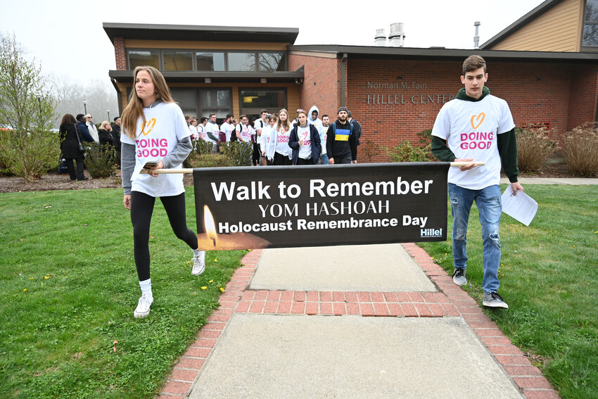 Molly Stogner, left, leads URI students on a &ldquo;Walk to Remember&rdquo; to commemorate&nbsp;the Holocaust.