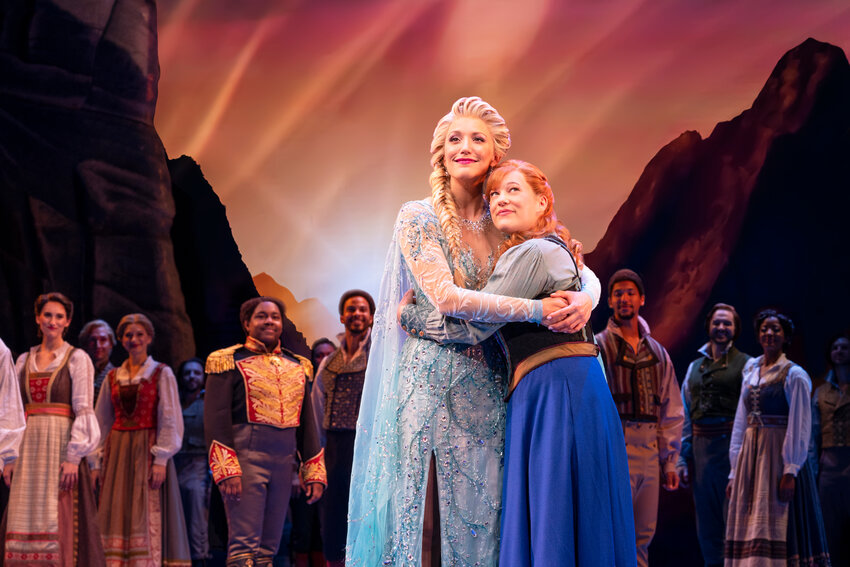 Caroline Bowman (left) as Elsa, Lauren Nicole Chapman as Anna, and ensemble members in the North American tour of &ldquo;Frozen,&rdquo; playing at Providence Performing Arts Center through March 17, 2024.