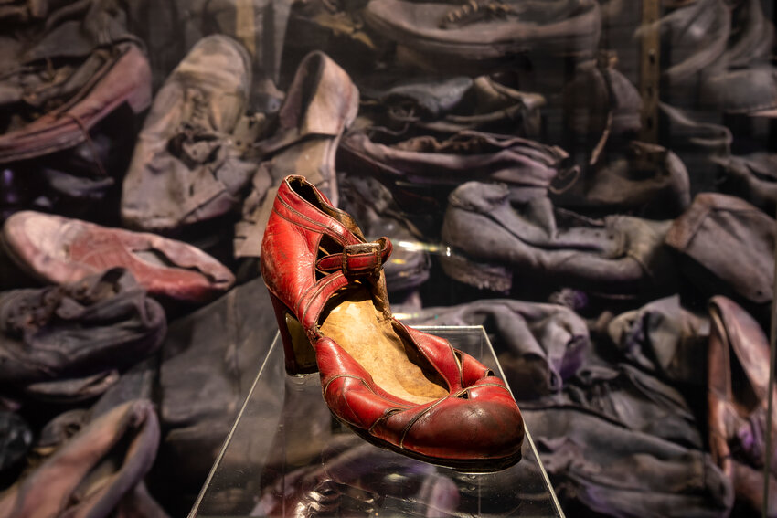 A red dress shoe belonging to a female deportee at &quot;Auschwitz. Not long ago. No far away.&quot; at The Castle at Park Plaza in Boston through Sept. 2.