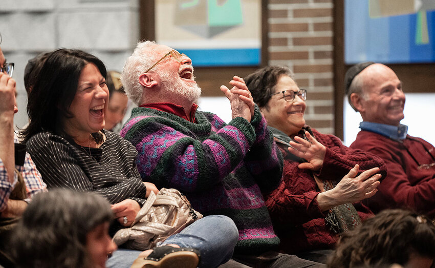 The audience at Temple Emanu-El&rsquo;s spiel has a laugh at a skit.