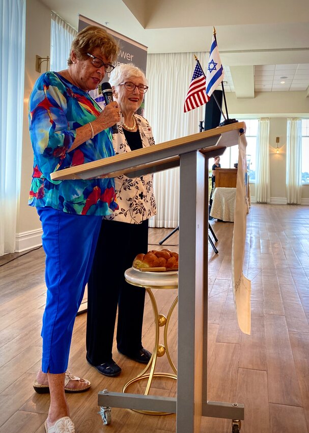 Rita Slom, right, said the motzi, here with Sue Mayes.