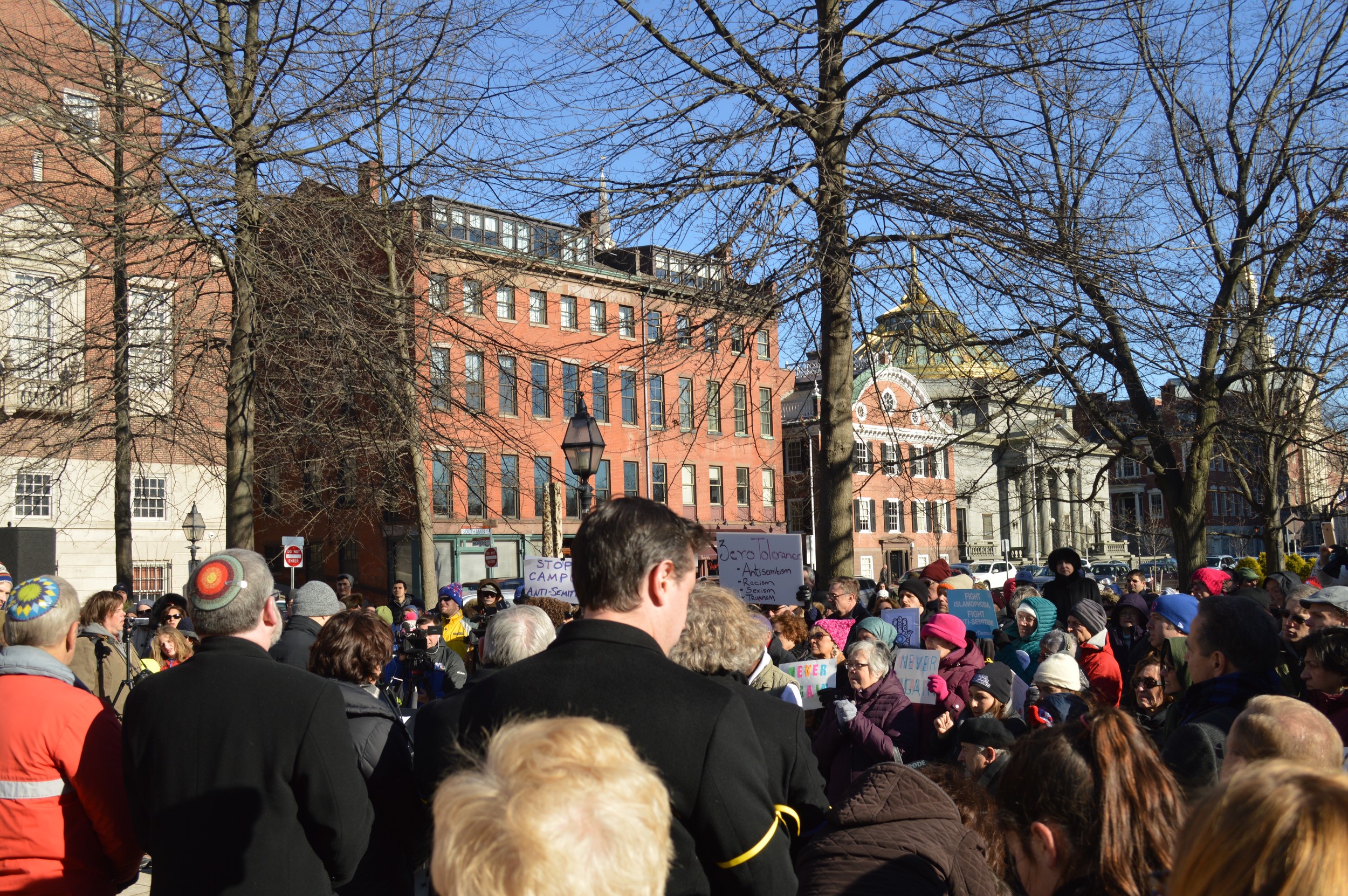 A crowd of about 300 listened to speakers Sunday afternoon at the vigil, "Never Again Means Never Again."
