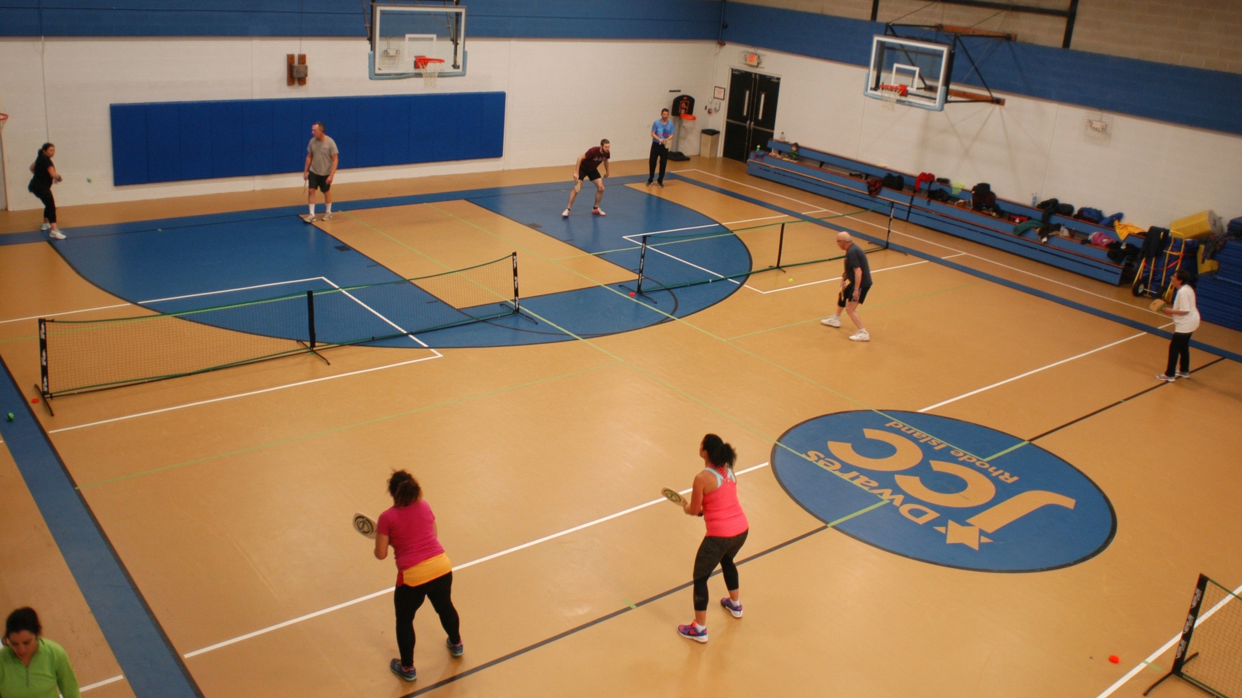 Players enjoy and evening of friendly paddleball games with seven teams of two or three players in a round robin competition.