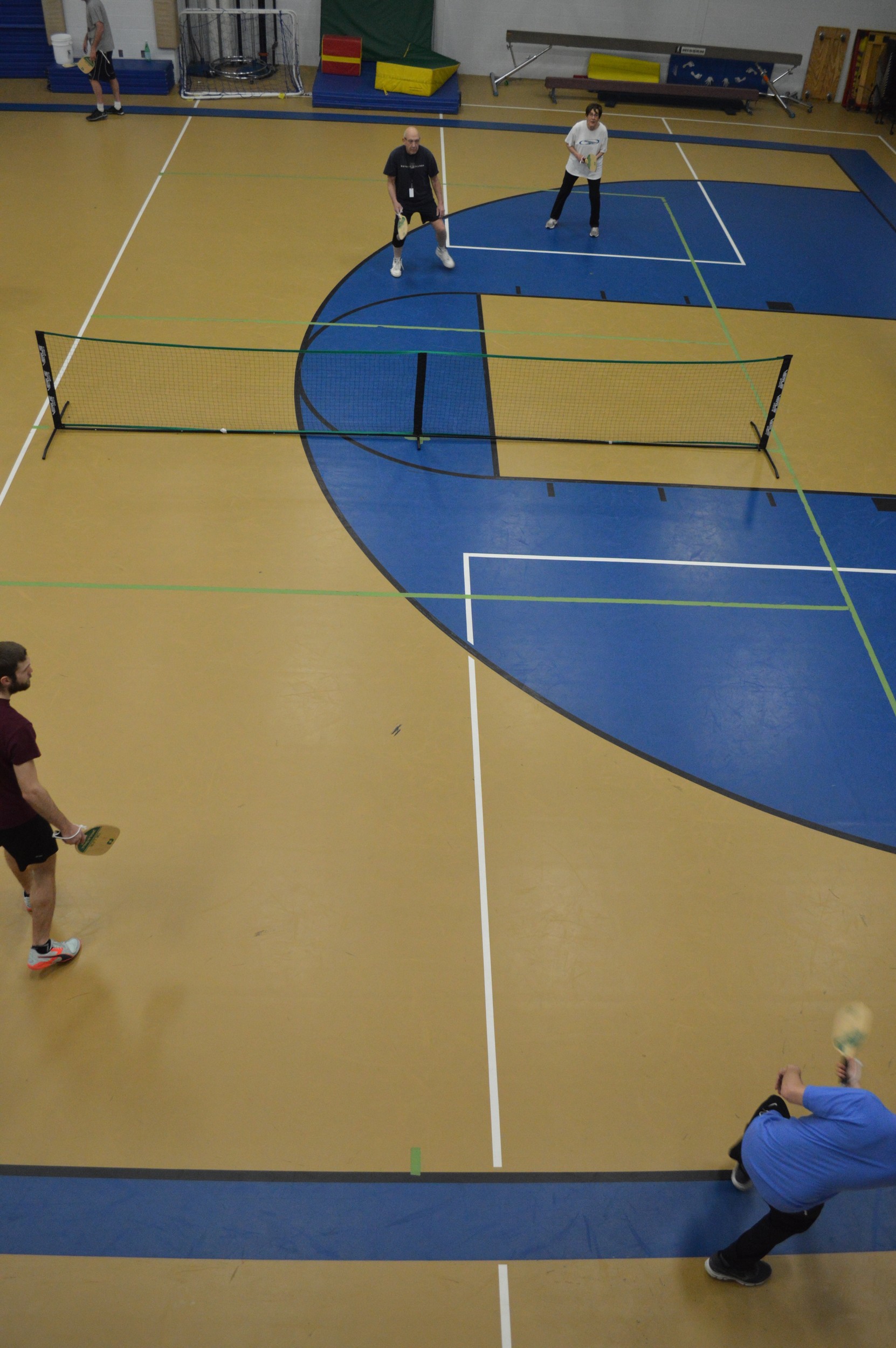 Players enjoy and evening of friendly paddleball games with seven teams of two or three players in a round robin competition.