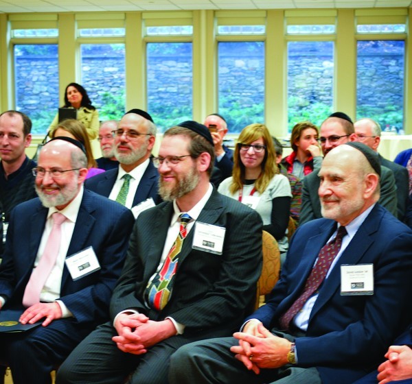 Marc Diamond, left, Rabbi Yechezkel Yudkowsky 
and David London listen to Mayor Elorza.