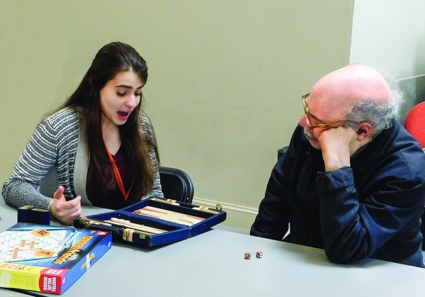 Dwares Jewish Community Center teens recently enjoyed an afternoon of board games and conversation with Kosher Café seniors, following a meal.