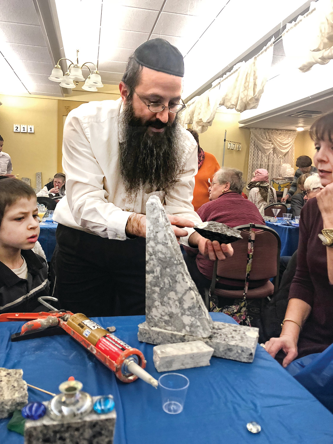 At a recent Menorahs and Martinis event hosted by West Bay Chabad, Beverly Paris reports that 40 to 50 ladies attended and all went home with a handmade menorah. Shoshana Laufer hosted and Rabbi Yossi Laufer helped. Paris reports there was good food and good company as well as beautiful menorahs.