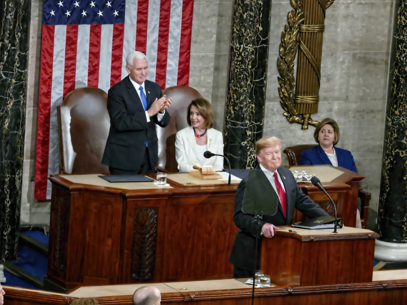 During the State of the Union address in February, Nancy Pelosi, Speaker of the House, sits out an applause line as Vice President Pence rises in support of many of the President’s agenda priorities including building a wall to prevent illegal immigration, limiting late term abortions, and defending America against Socialism.
