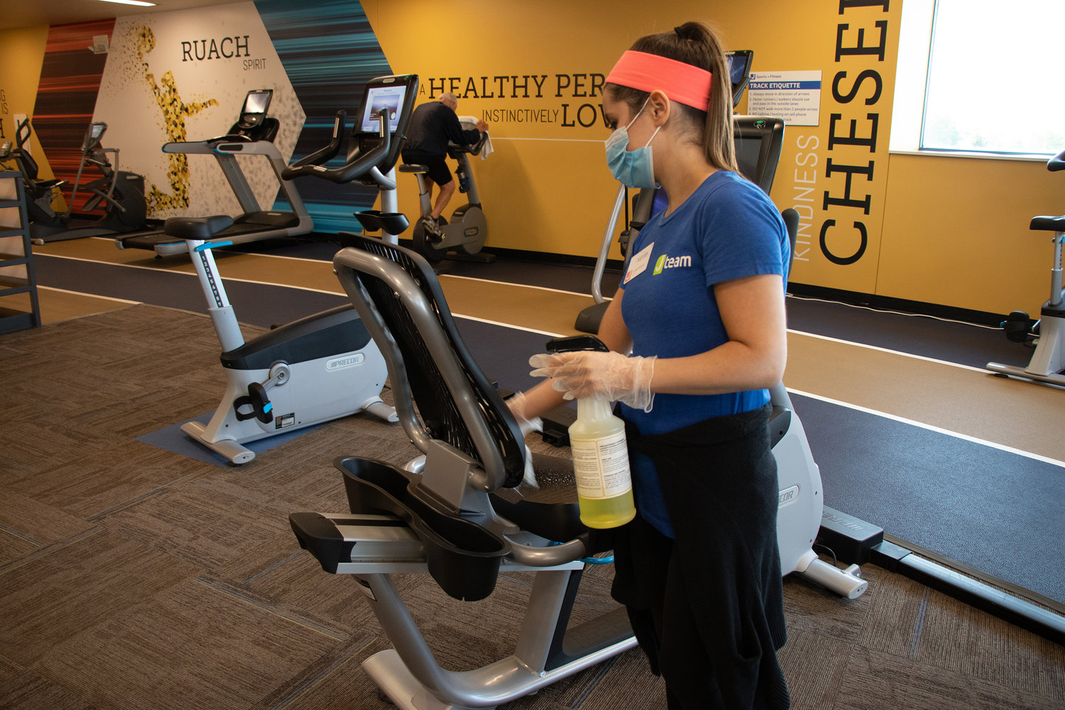 At the JCC in Overland Park, Kansas, gym equipment is cleaned between uses to limit the possibility of coronavirus infection.