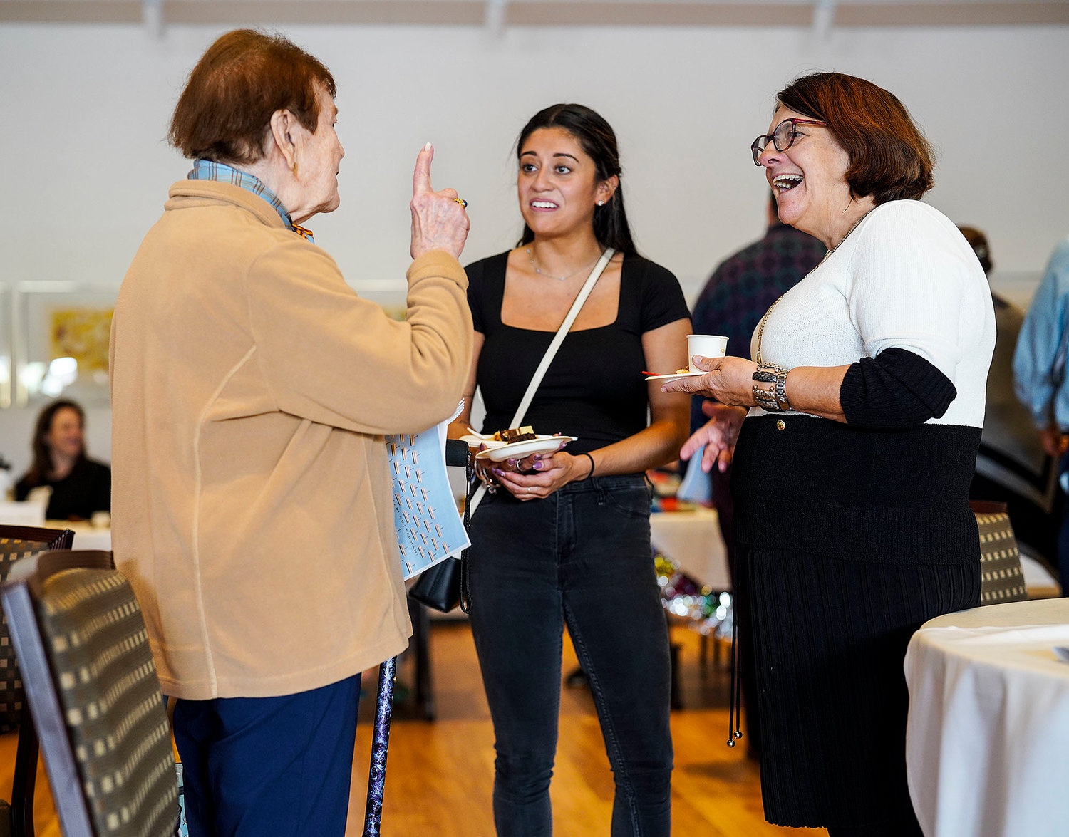 Gloria Feibish, of North Providence, left, catches up with former neighbors Caroline Axelrod, of Warwick, center, and her mother Adelina Axelrod, of Bristol.