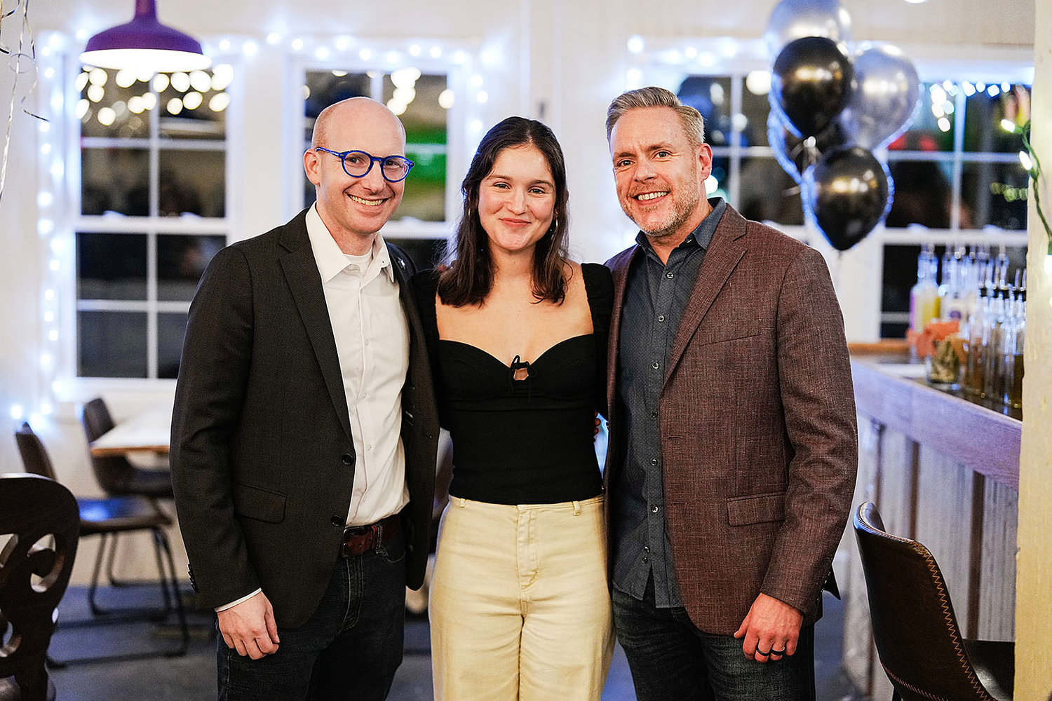 Adam Greenman, Alliance president and CEO, Emma Newbery, podcast producer, and Brian Sullivan, Alliance chief content officer, at the launch celebration for "Breaking the Glass."
