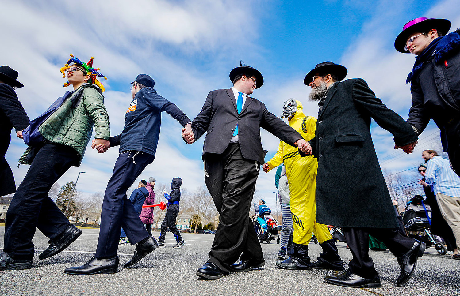 Costumed participants sing, dance and celebrate as they march down Morris Avenue in the Purim Parade.