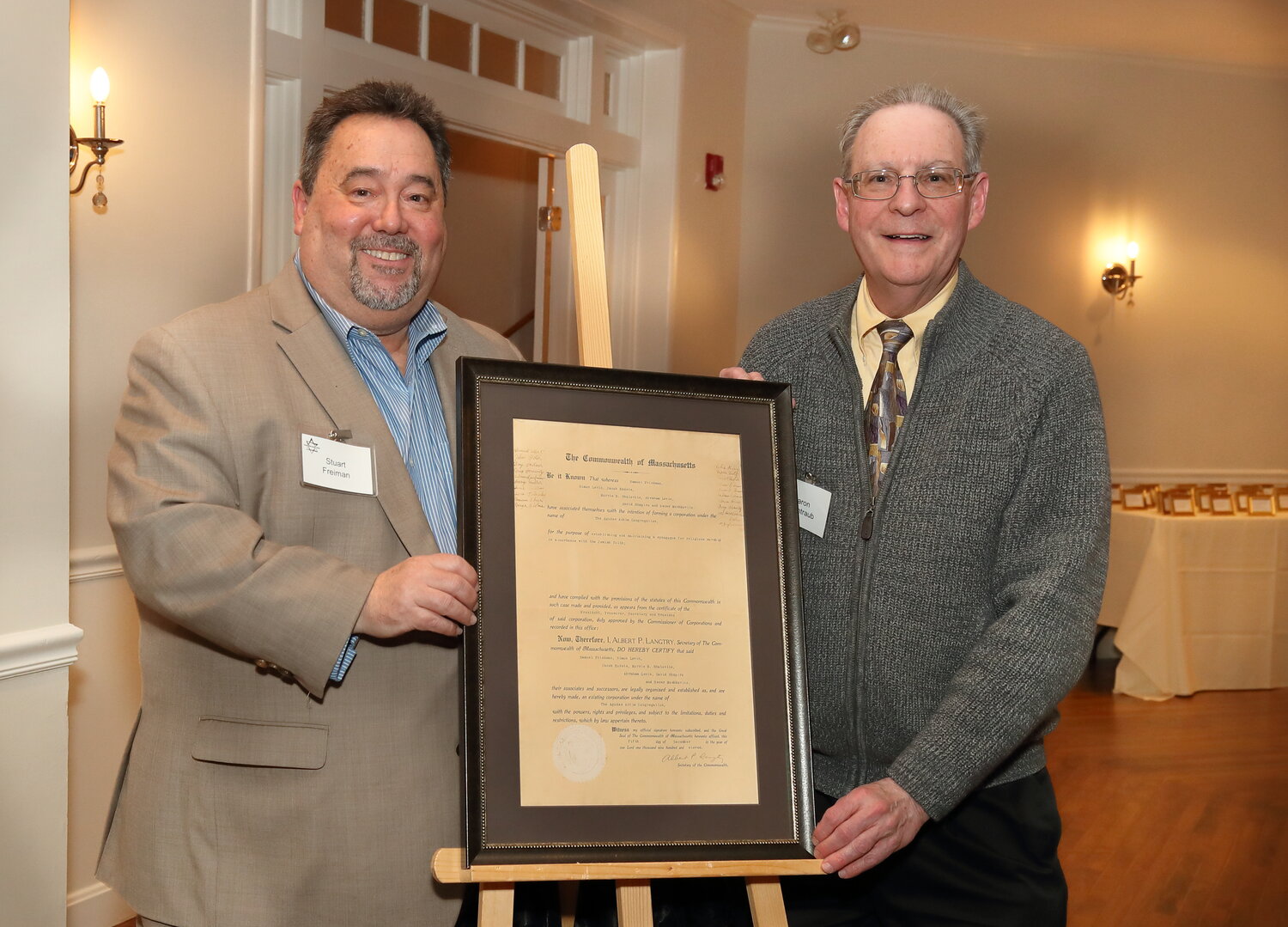 Stuart Freiman and Aaron Weintraub unveiled a reproduction of Congregation Agudas Achim’s newly restored and preserved Articles of Incorporation.