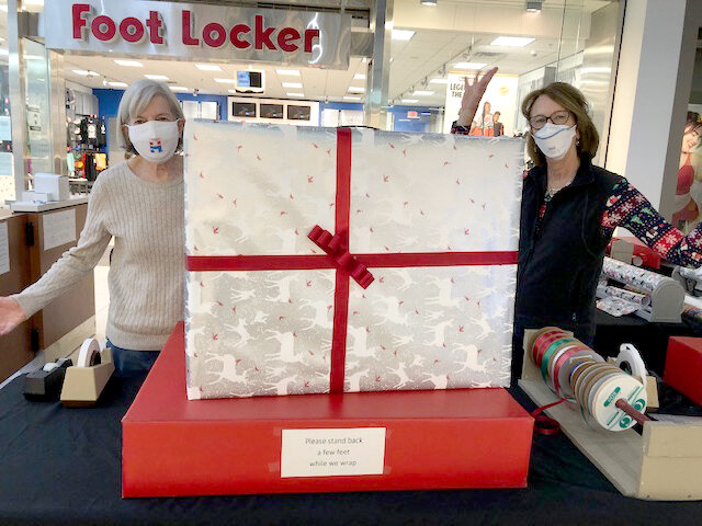 Judy Silverman and Karen Beraha with a nicely wrapped gift.