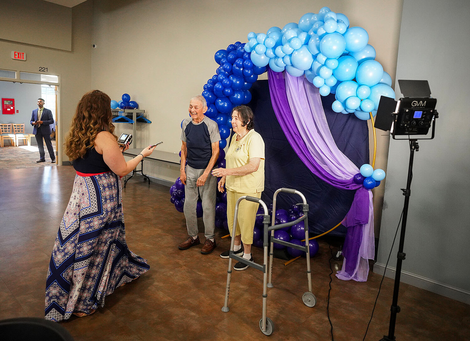 Lawrence Priest and his wife, Harriet, of Providence, have their photo taken under an arch of balloons.