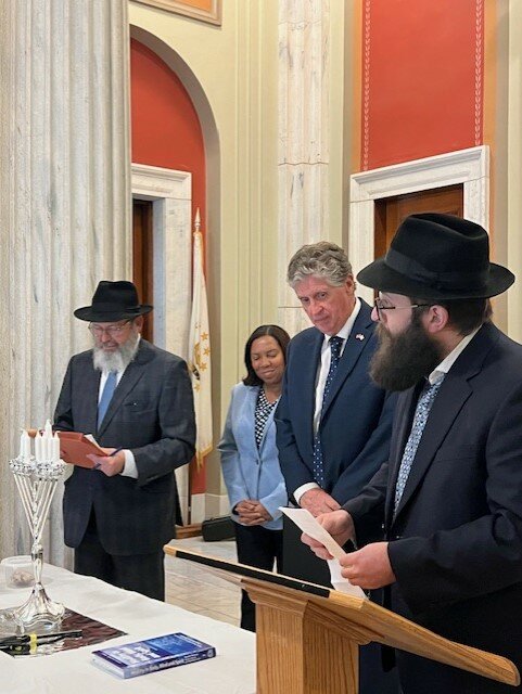 Lt. Gov. Sabina Matos and Gov. Dan McKee participate in a Hanukkah celebration at the Rhode Island State House Dec. 11, 2023. The Chabad-sponsored program included candle lighting, music, latkes and dreidels.