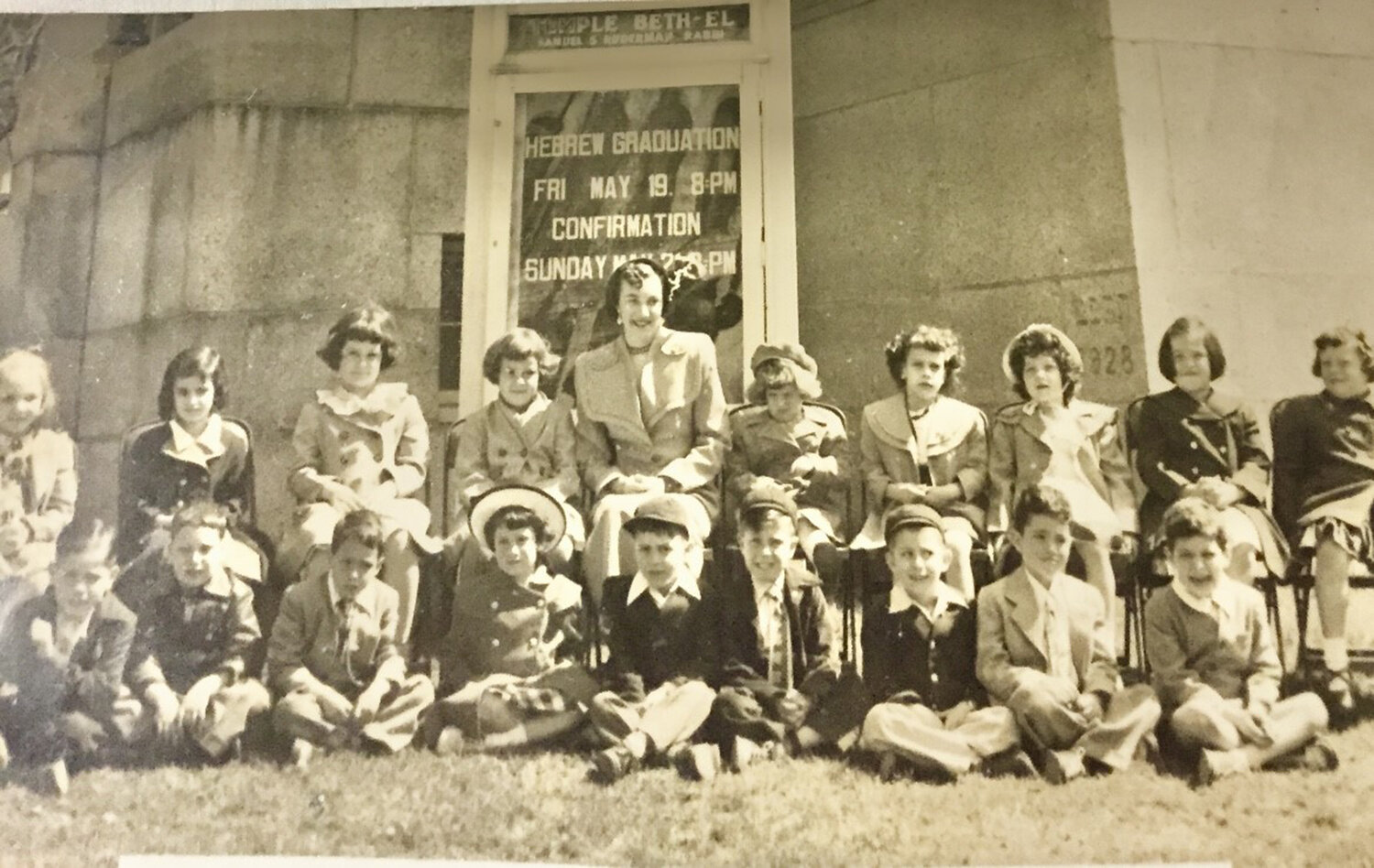 This 1950 photo is of the 1949-50 pre-primary (kindergarten) class at Temple Beth El’s Sunday School. Teacher was Eleanor Lechan. The writer is the third boy from the right. The little girl with the broad brim hat is Eileen Shaw Horwitz who also now lives in Providence.