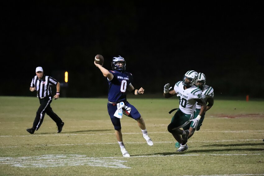 Landon Sharpe launches a touchdown pass in the first half of White Knoll's 17-14 win over Dutch Fork.