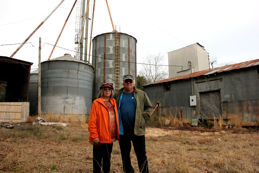 Venetia and John Sharpe stand in front of the Swansea grain silos they hope to turn into a destination for pottery and metal working.
