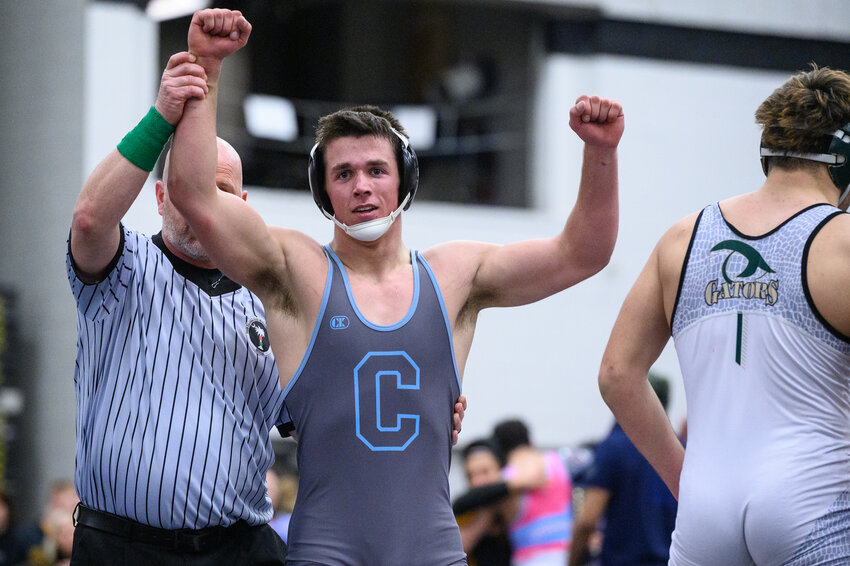 Toler Hornick of Chapin High School celebrates his victory over cross-county rival Reese Lawrence of River Bluff in the 5A 190-pound weight class championship.