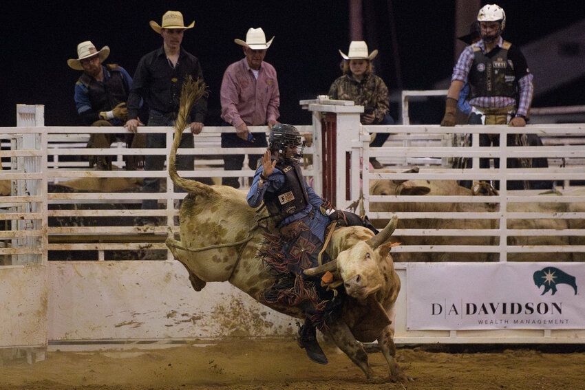 A rider on a bull at the 2024 Bull Bash during the South Congaree Championship Rodeo in West Columbia on March 23, 2024.