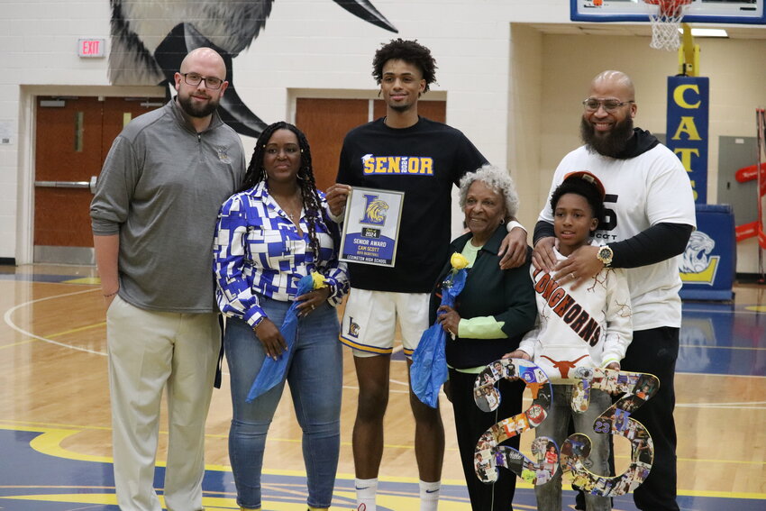 Former Lexington basketball star Cam Scott decommitted from Texas and announced his decision to play at the University of South Carolina under head coach Lamont Paris.