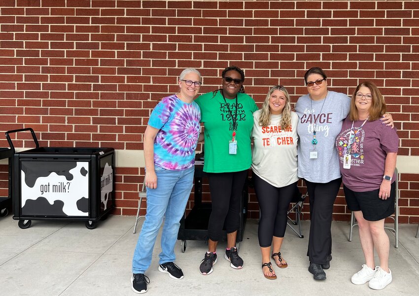 Principal Elaine Lundy, left, is joined by Cayce Elementary colleagues Dr. Hawana Amaker, Casey Corbitt, Amanda Lee and Michelle Feaster at the school to serve free lunches to kids on Monday.