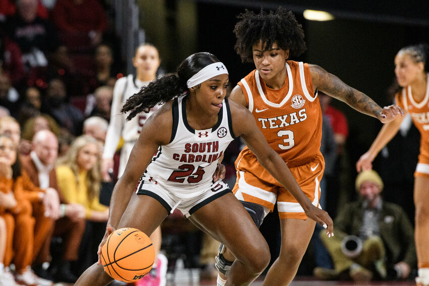 South Carolina guard Raven Johnson (25) drives past Texas guard Rori Harmon (3) during the first half of the game at Colonial Life Arena in Columbia, S.C., on Sunday, Jan. 12, 2025. South Carolina defeated Texas, 67-50.