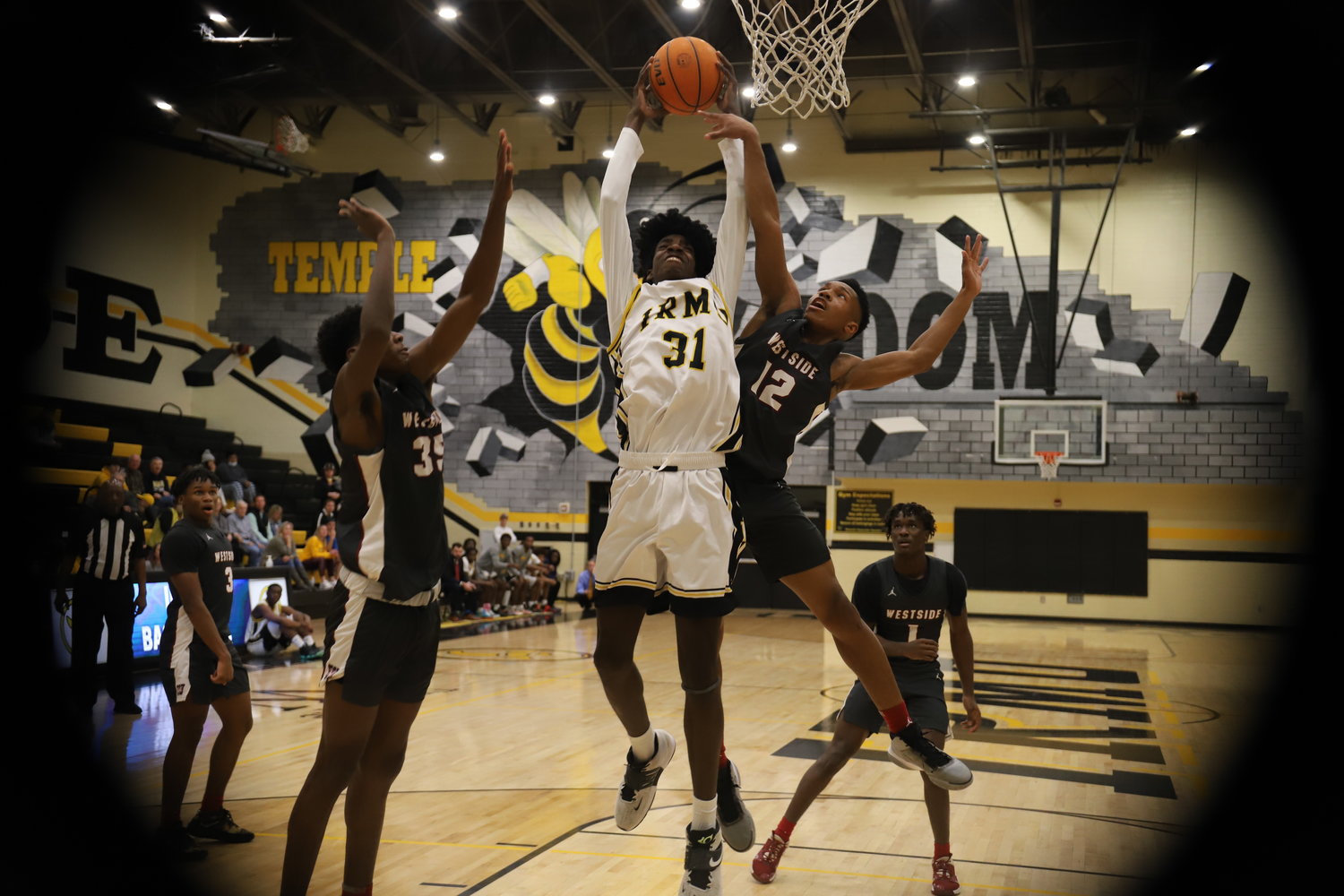 Irmo center Brandon Crawford goes up for the dunk against Westside