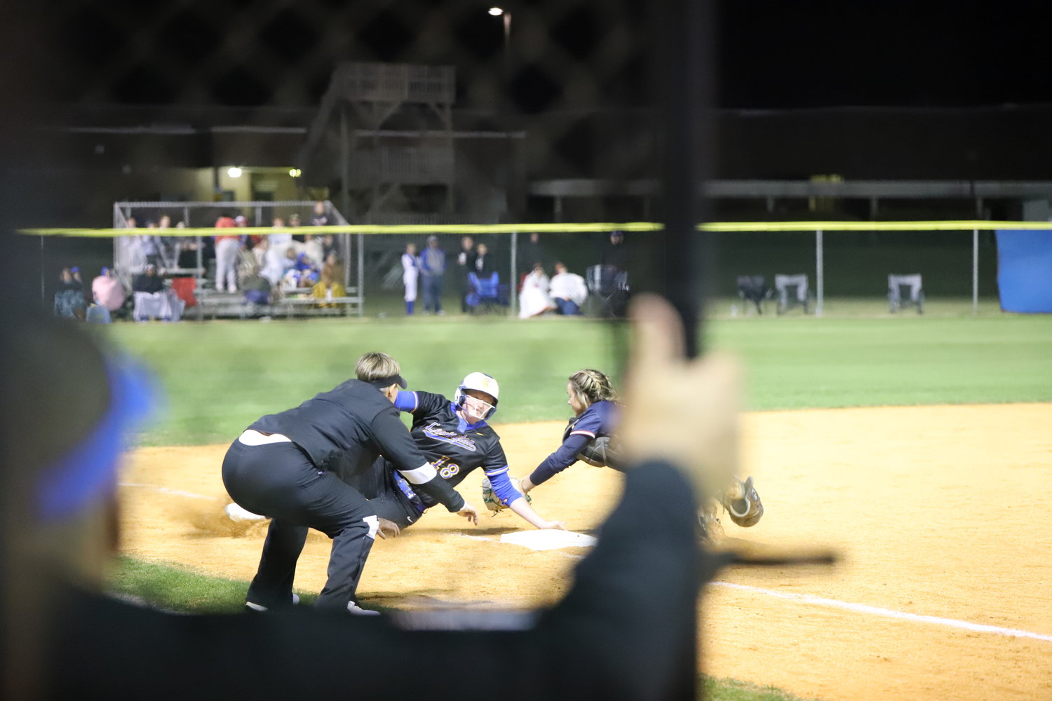 Lexington's Madison Rogers is thrown out at third base.