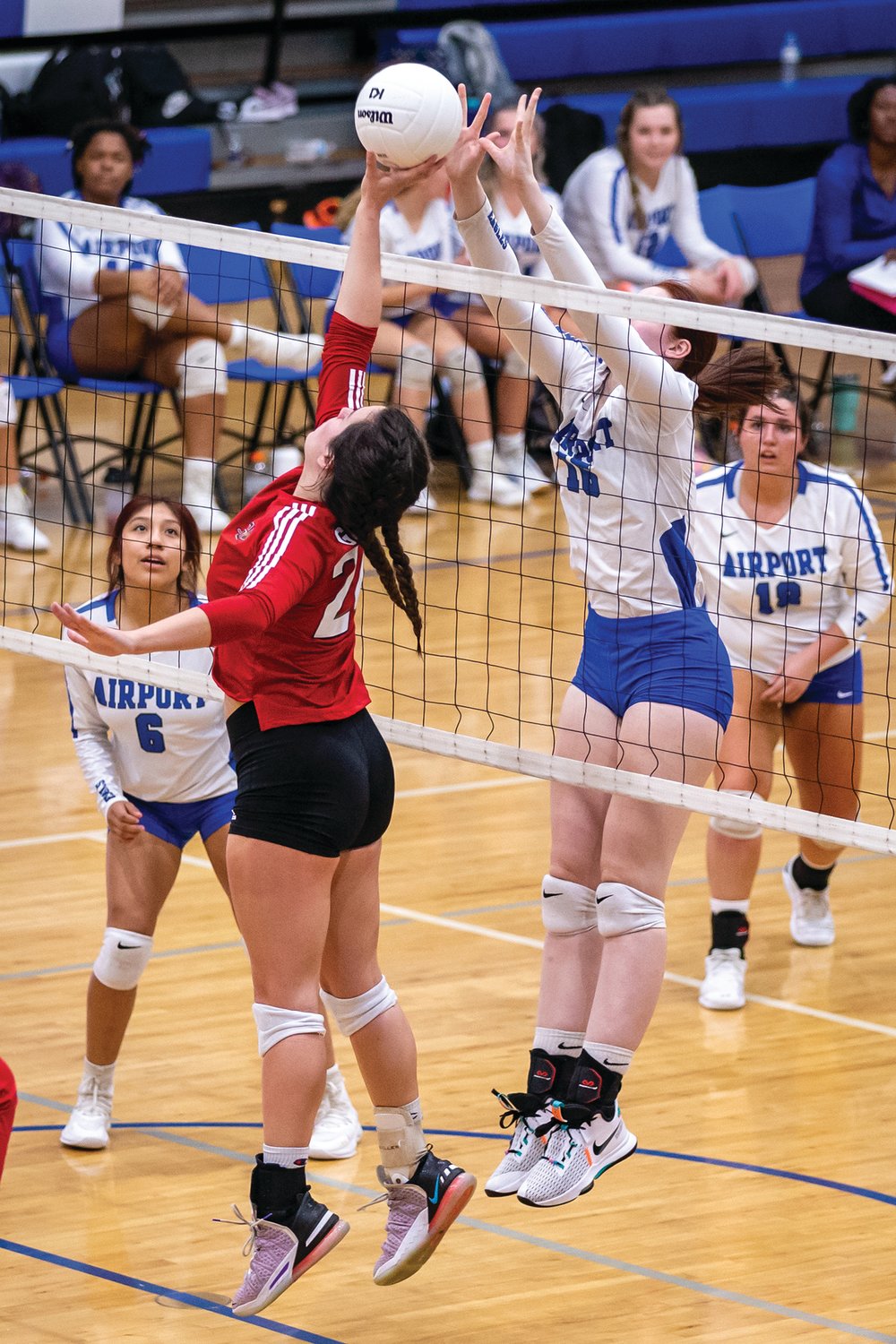 Net action between Airport and Gilbert in the Sept. 20 match won by the Lady Indians