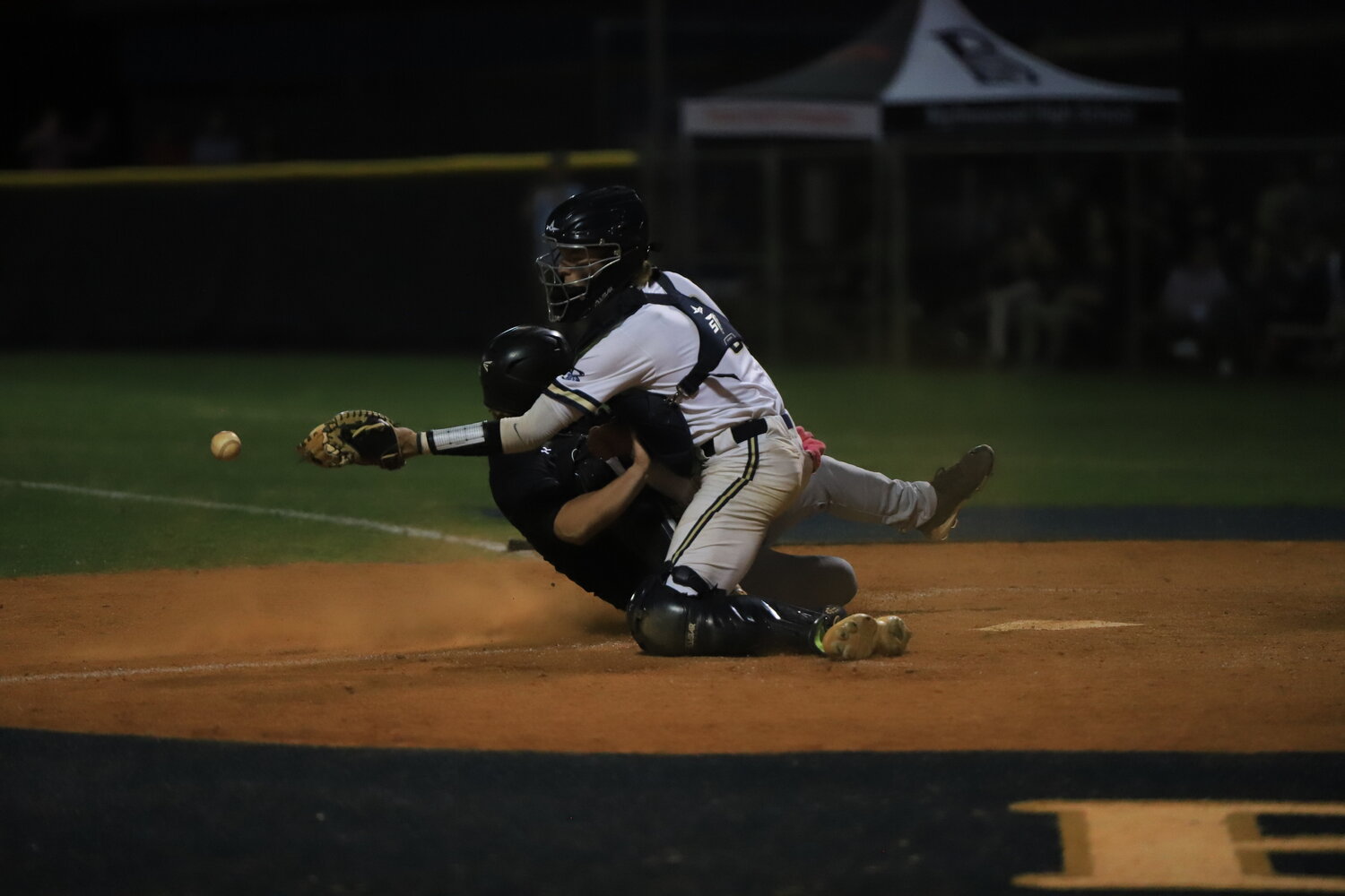 Coleman Szuhy slides underneath the Blythewood catcher to give the Gators a 9-7 lead in the top of the seventh inning.