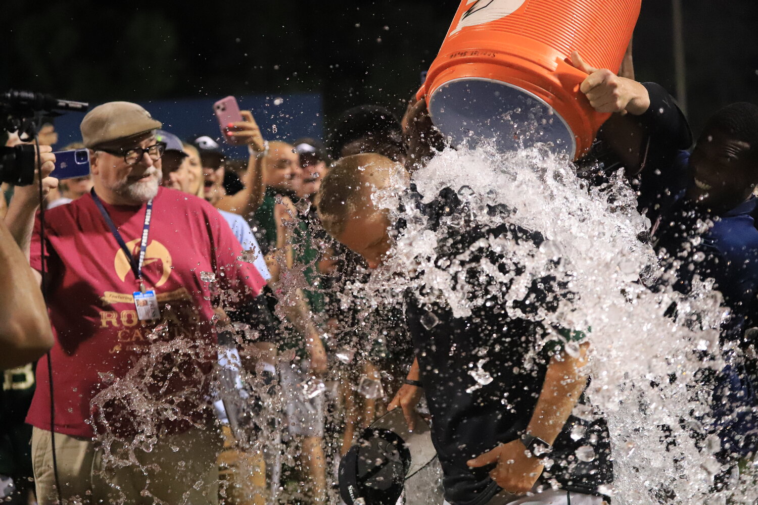 River Bluff coach Mark Bonnette gets doused in ice water following his team's 5A state championship win against Blythewood Wednesday night.