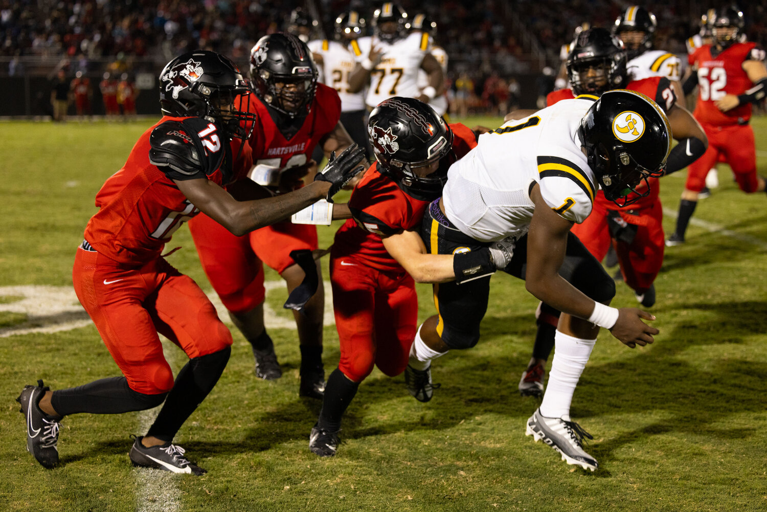 Yellow Jackets quarterback Aaron Brand runs the ball toward the sideline in the second quarter of Irmo's 35-21 win over Hartsville.