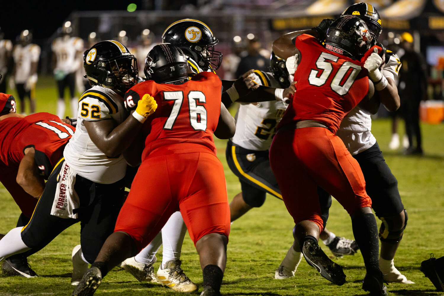 Hartsville defenders try to tackle Yellow Jackets running back Jaden Allen-Hendrix as he sneaks the ball behind his offensive line in the third quarter.