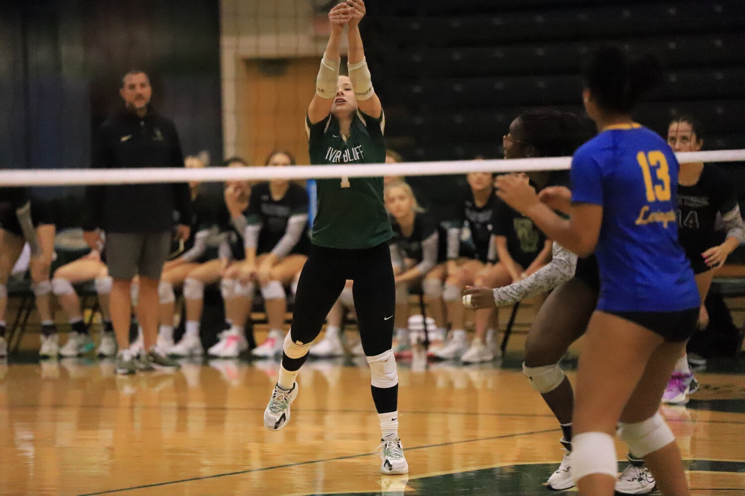 River Bluff’s Masyn McClanahan attempts a serve during their 3-0 loss to Lexington.