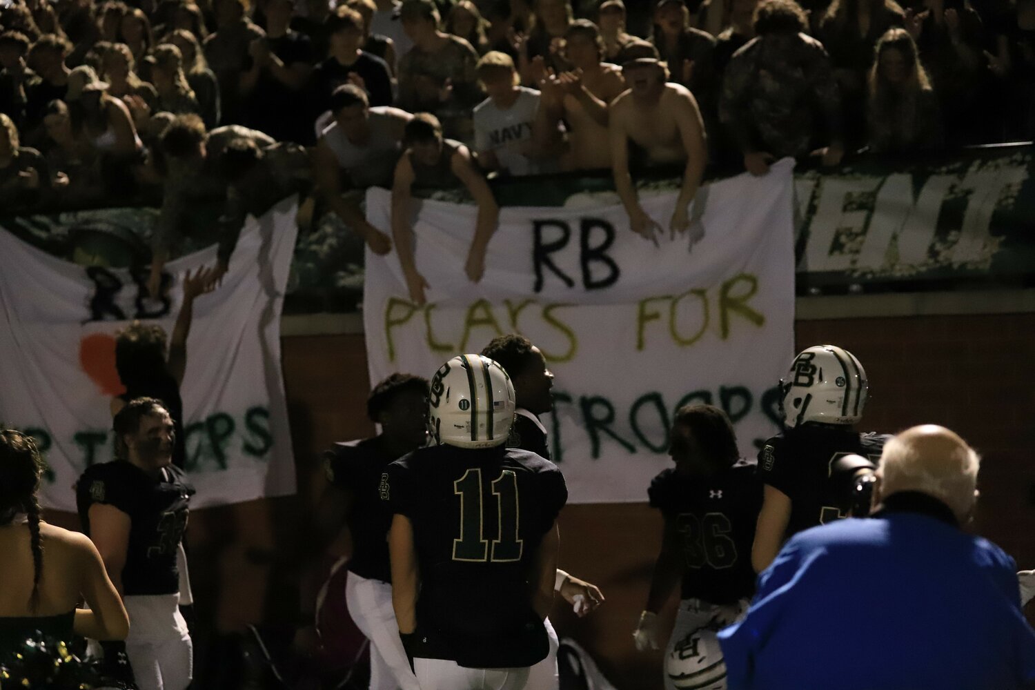 The River Bluff players celebrate with the student section after they clinched their thrilling 29-28 win over Dorman.