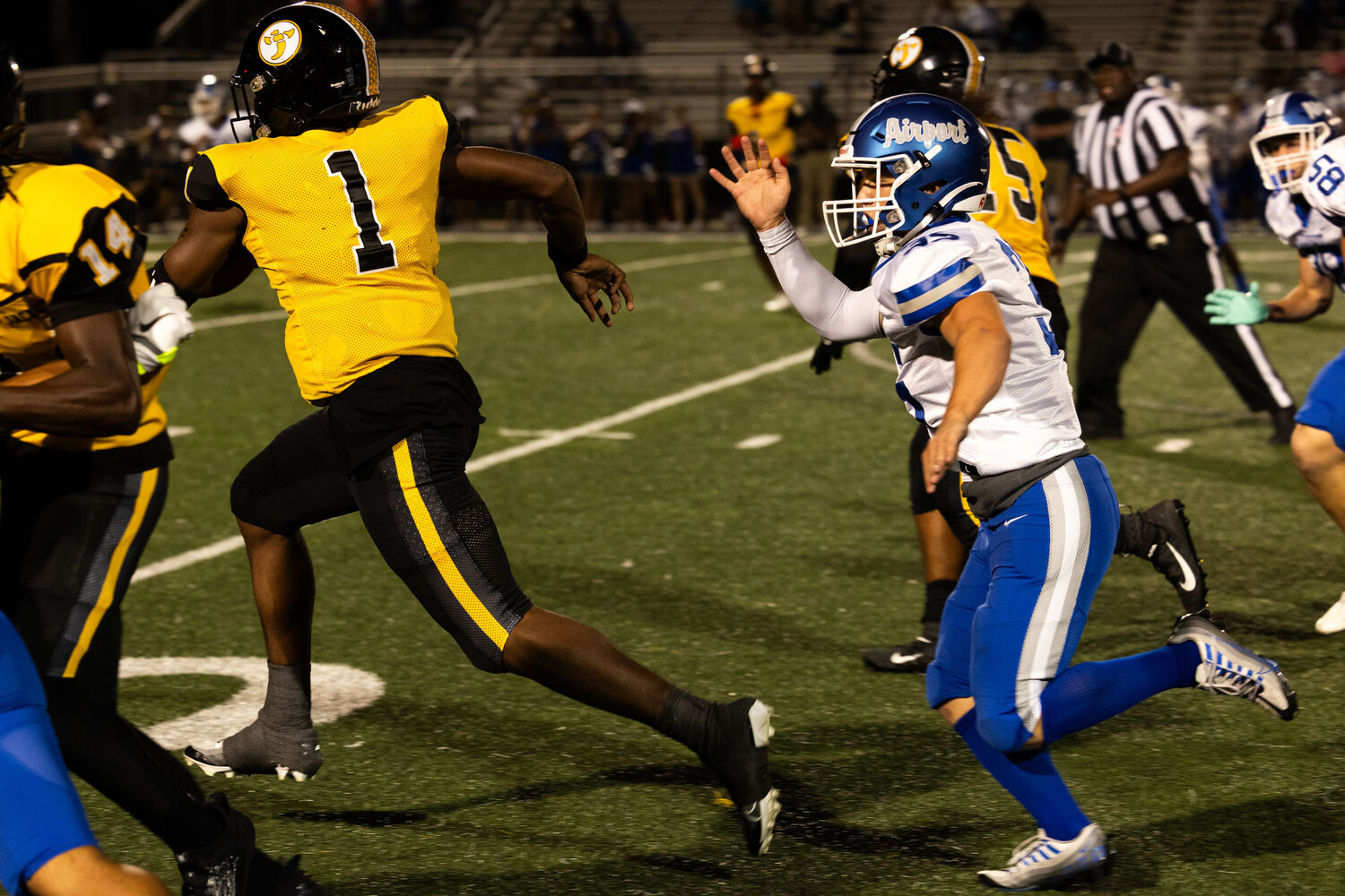 Irmo quarterback Aaron Brand carries the ball down the field during the first quarter against the Eagles.