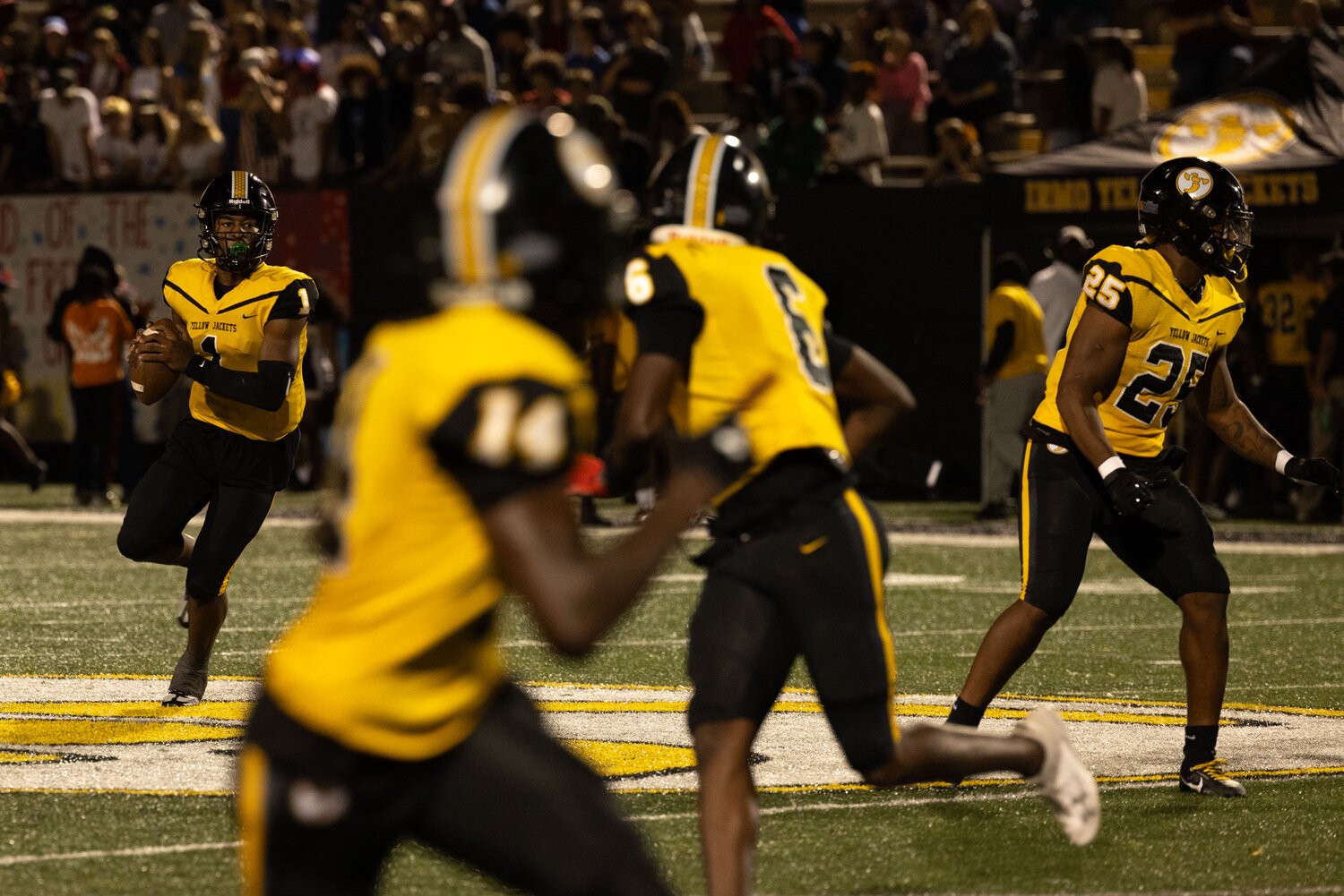 Electric Irmo quarterback A.J. Brand rolls out to pass during Irmo's 54-0 win over Airport.