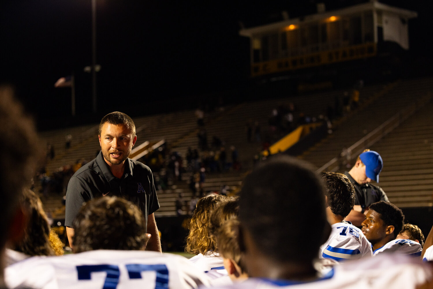 Airport head coach Shane Fidler talks to his players after a difficult loss to Irmo.