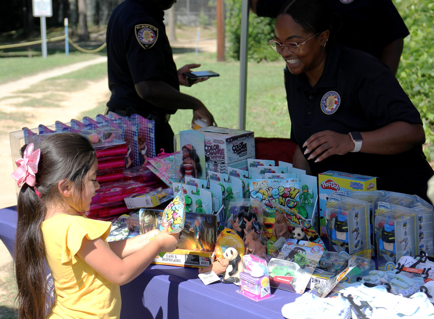A child picks out a toy at the Cayce Police tent at the department's annual Fiesta.