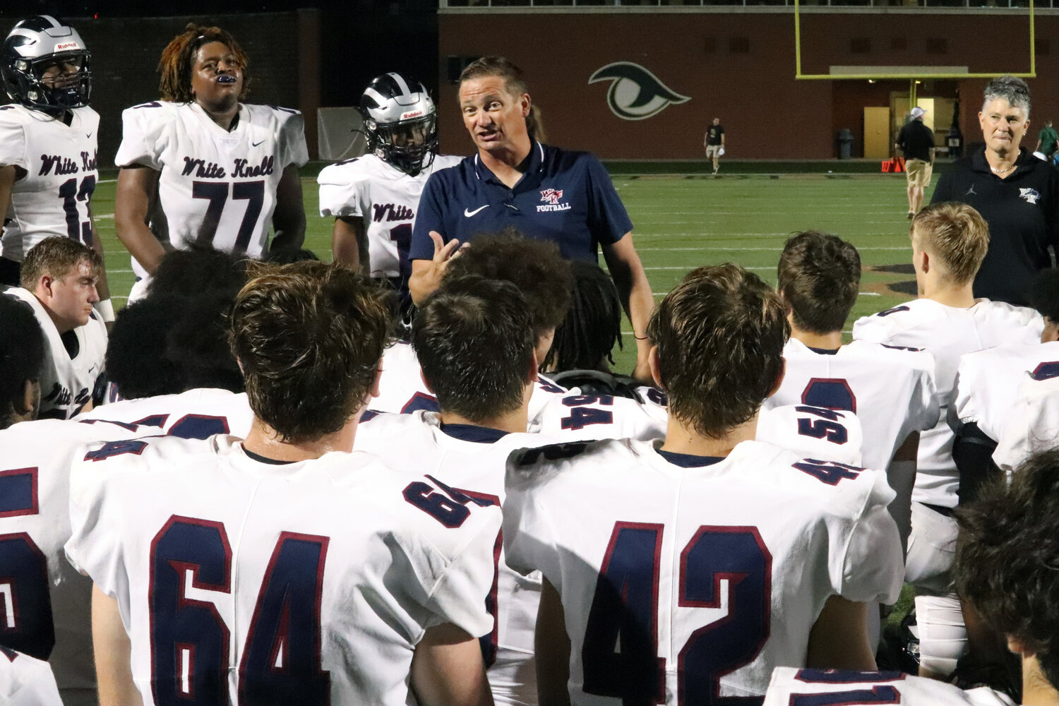 White Knoll head coach Nick Pelham addresses his team after their impressive 40-0 win over River Bluff Sept. 29.