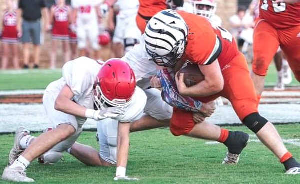 Ashton imposed his will against two Cache Bulldogs trying to shut down another long gain for the Tiger offense.