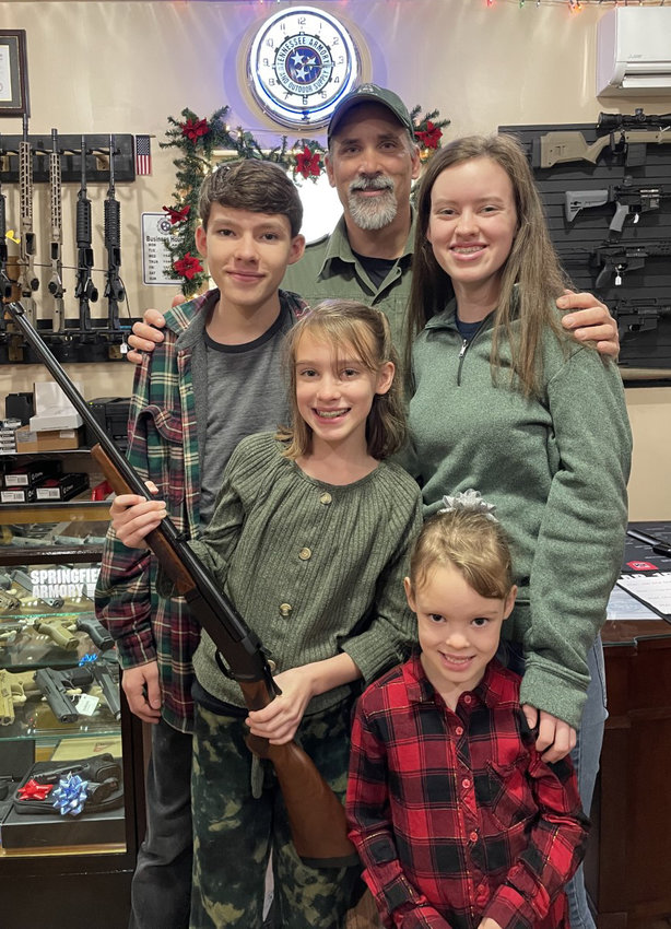 Tennessee Wildlife Resources Agency Wildlife Officer Mark Ventura pictured with winners of the Henry .243 Youth Rifle presented December 21 in Chapel Hill at Tennessee Armory and Outdoor Supply. Clockwise from top are Mark Ventura, Ellarose Strasser, Rita Strasser, Josie Strasser and Jude Strasser.
