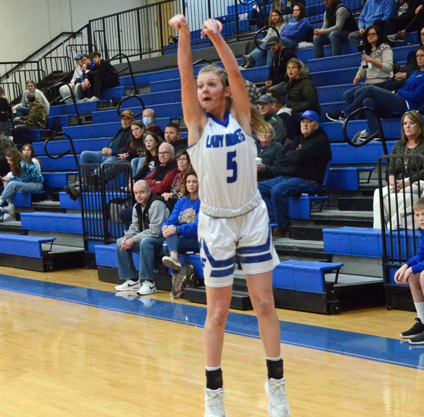 Macyn Kirby, who led the Lady Rockets with 15 points, drains a 3-pointer in the first half.
