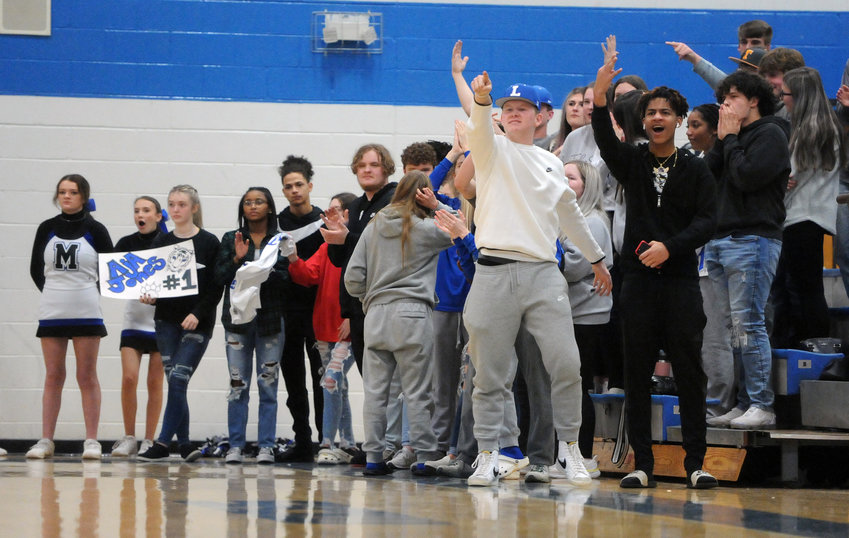 The Marshall County student section lets out a cheer during Tuesday night&rsquo;s District 8-AAA matchup against Tullahoma after a key play in the Tigers&rsquo; game against the Wildcats.
