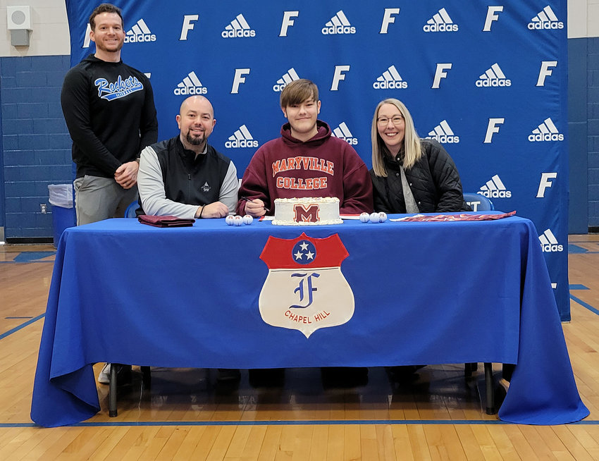 Sebastian Thompson signs his letter of intent to continue his college career at Maryville College.