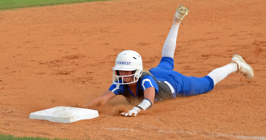 Forrest&rsquo;s Macyn Kirby, who went a perfect 4-for-4 at the plate, slides safely in to third base with a leadoff triple in the bottom of the first inning.