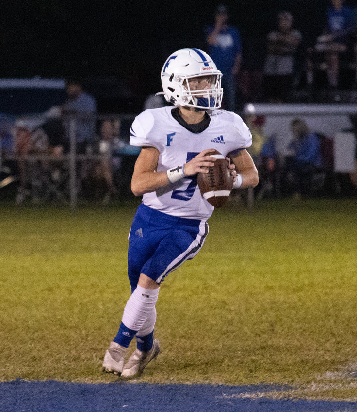 Forrest quarterback Ryan Hill looks for an open receiver.