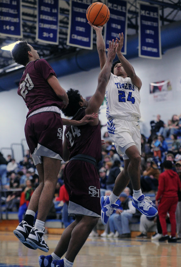Jamahl Gentry battles his way to the rim and draws the foul. He finished with a game-high 15 points.
